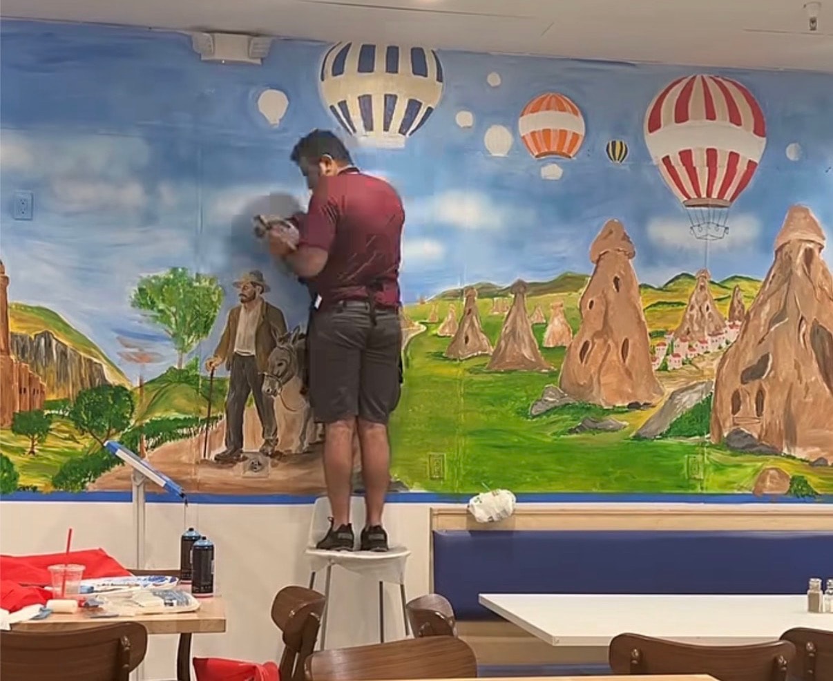 Lizzart — mural artist at work